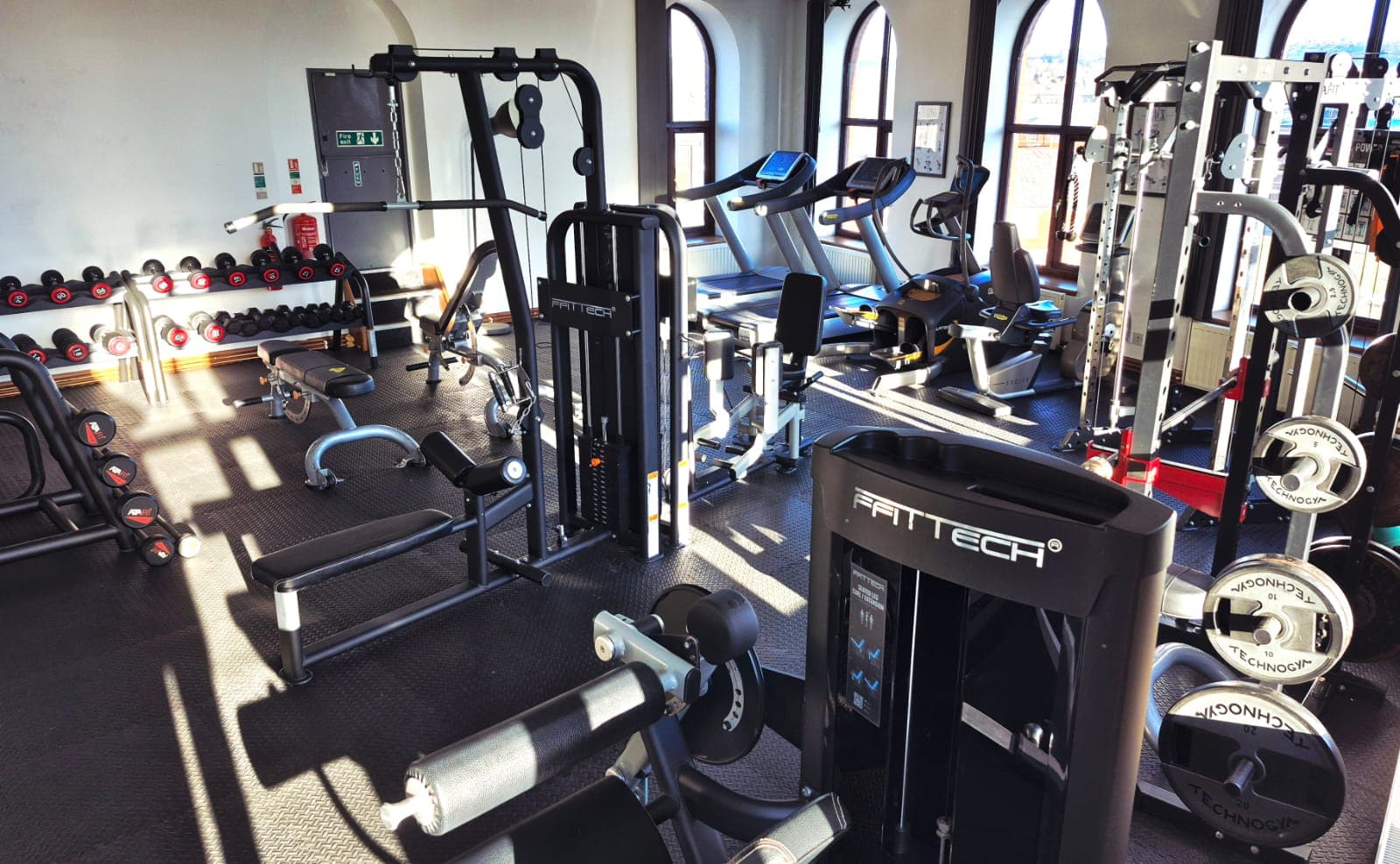 Gym floor with green turf and equipment